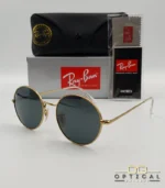 Lunettes de soleil de luxe Ray-Ban Oval RB1970 dorées avec verres foncés, étui en cuir et packaging d'origine - Optical Gallery.
