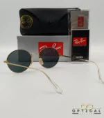 Lunettes de soleil de luxe Ray-Ban Oval RB1970 dorées avec verres foncés, étui en cuir et packaging d'origine - Optical Gallery.