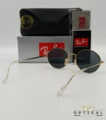Lunettes de soleil de luxe Ray-Ban Oval RB1970 dorées avec verres foncés, étui en cuir et packaging d'origine - Optical Gallery.