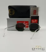 Lunettes de soleil géométriques octogonales Ray-Ban RB1972 dorées avec verres verts, présentées avec leur étui en cuir marron et le logo Optical Gallery.