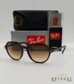 Lunettes de soleil Ray-Ban Thalia RB2195 avec monture fine en acétate écaille de tortue et verres teintés, présentées avec leur étui noir - Optical Gallery.