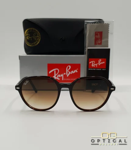Lunettes de soleil Ray-Ban Thalia RB2195 avec monture fine en acétate écaille de tortue et verres teintés, présentées avec leur étui noir - Optical Gallery.