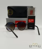 Lunettes de soleil Ray-Ban Thalia RB2195 avec monture fine en acétate écaille de tortue et verres teintés, présentées avec leur étui noir - Optical Gallery.