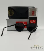 Lunettes de soleil Ray-Ban Thalia RB2195 avec monture en acétate noir brillant et verres teintés foncés, présentées avec leur étui noir et le logo Optical Gallery.