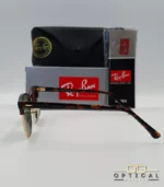 Lunettes de soleil Ray-Ban Clubmaster RB3016 monture écaille de tortue et métal doré avec verres verts G-15, étui et boîte d'origine.