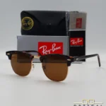 Lunettes de soleil Ray-Ban Clubmaster RB3016 monture écaille de tortue et métal doré avec verres marrons, étui et boîte d'origine.