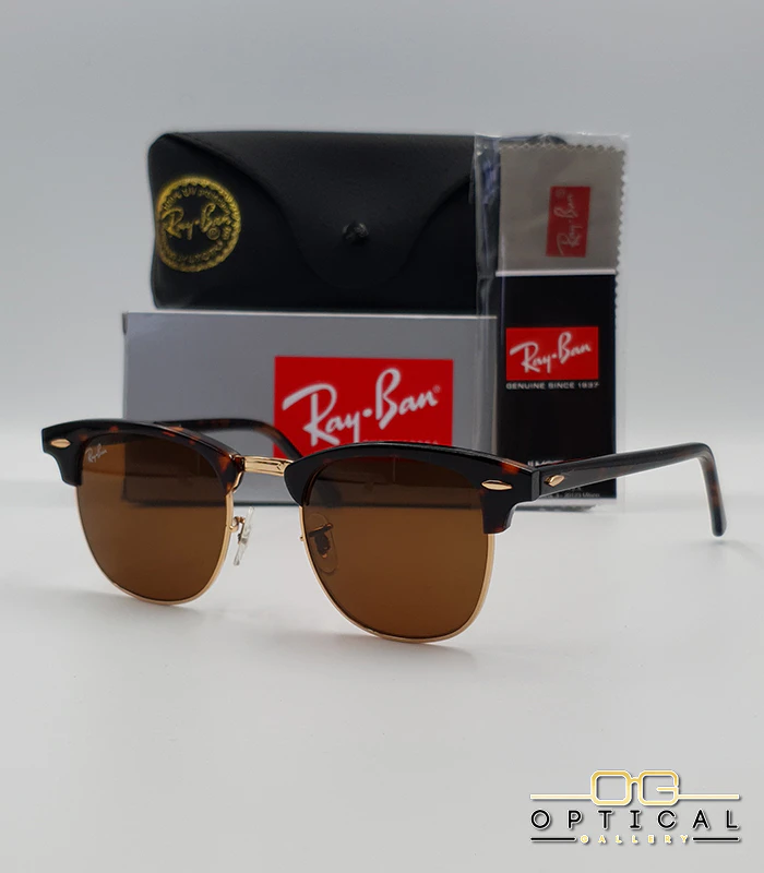 Lunettes de soleil Ray-Ban Clubmaster RB3016 - Écaille Tortoise / Doré / Marron Lunettes de soleil Ray-Ban Clubmaster RB3016 monture écaille de tortue et métal doré avec verres marrons, étui et boîte d'origine.