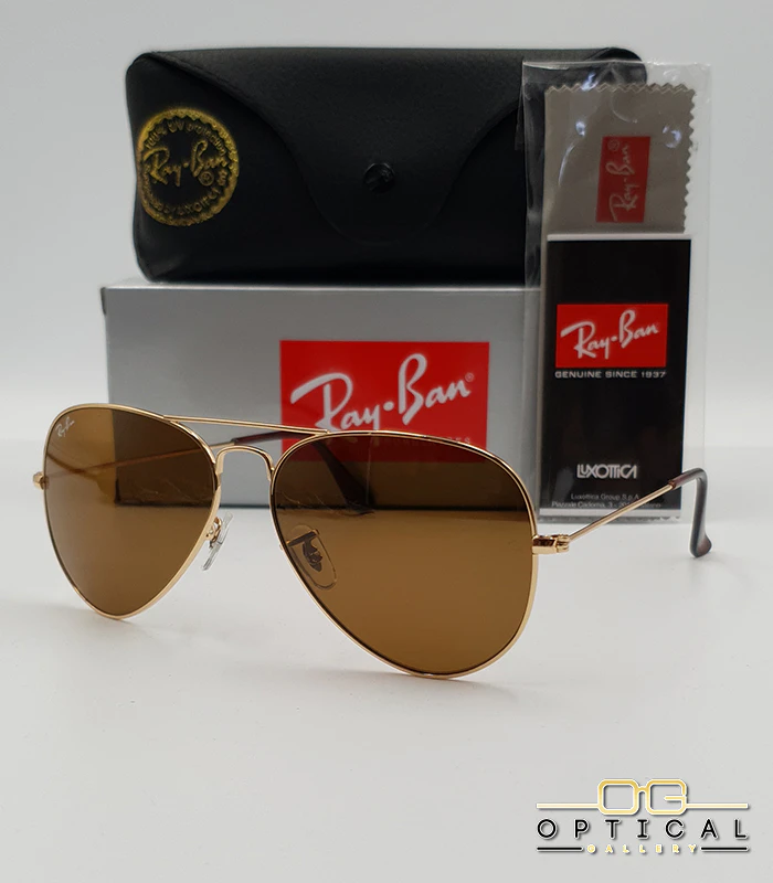 Lunettes de soleil Ray-Ban Aviator RB3025 - Doré / Marron B-15 Lunettes de soleil Ray-Ban Aviator RB3025 monture métallique dorée avec verres marrons classiques B-15, étui et boîte d'origine.