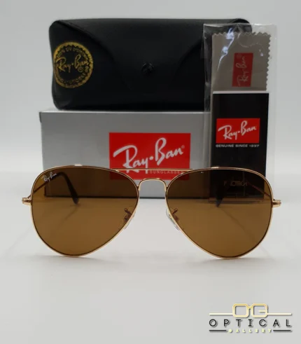 Lunettes de soleil Ray-Ban Aviator RB3025 monture métallique dorée avec verres marrons classiques B-15, étui et boîte d'origine.