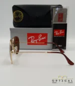 Lunettes de soleil Ray-Ban Aviator RB3025 monture métallique dorée avec verres marrons classiques B-15, étui et boîte d'origine.