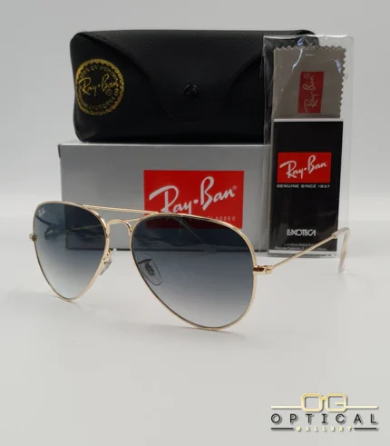 Lunettes de soleil Ray-Ban Aviator RB3025 monture métallique dorée avec verres dégradés gris-bleu, étui et boîte d'origine.