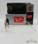 Lunettes de soleil Ray-Ban Aviator RB3025 monture métallique dorée avec verres dégradés gris-bleu, étui et boîte d'origine.