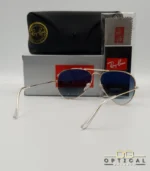 Lunettes de soleil Ray-Ban Aviator RB3025 monture métallique dorée avec verres dégradés gris-bleu, étui et boîte d'origine.