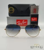 Lunettes de soleil Ray-Ban Aviator RB3025 monture métallique dorée avec verres dégradés bleus, étui et boîte d'origine.