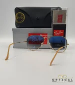 Lunettes de soleil Ray-Ban Aviator RB3025 monture métallique dorée avec verres dégradés bleus, étui et boîte d'origine.