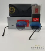 Lunettes de soleil Ray-Ban Aviator RB3025 monture métallique noire avec verres dégradés bleus, étui et boîte d'origine.
