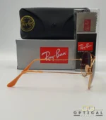 Lunettes de soleil Ray-Ban Aviator RB3025 monture métallique or rose avec verres dégradés marrons, étui et boîte d'origine.