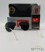 Lunettes de soleil Ray-Ban Aviator RB3025 monture métallique dorée avec verres noirs, étui et boîte d'origine.