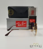 Lunettes de soleil Ray-Ban Aviator RB3025 monture métallique dorée avec verres dégradés marrons, étui et boîte d'origine.
