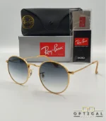 Lunettes de soleil Ray-Ban Round Metal RB3447 monture métallique dorée avec verres dégradés bleus, étui et boîte d'origine.