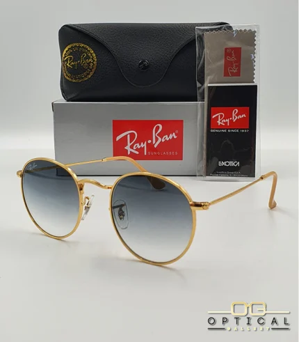 Lunettes de soleil Ray-Ban Round Metal RB3447 monture métallique dorée avec verres dégradés bleus, étui et boîte d'origine.