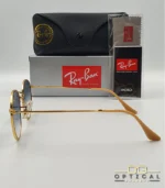 Lunettes de soleil Ray-Ban Round Metal RB3447 monture métallique dorée avec verres dégradés bleus, étui et boîte d'origine.