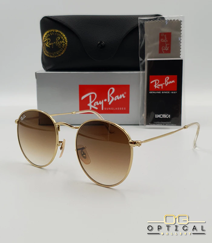 Lunettes de soleil Ray-Ban Round Metal RB3447 - Doré / Marron Dégradé Lunettes de soleil Ray-Ban Round Metal RB3447 monture métallique dorée avec verres dégradés marrons, étui et boîte d'origine.