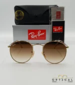 Lunettes de soleil Ray-Ban Round Metal RB3447 monture métallique dorée avec verres dégradés marrons, étui et boîte d'origine.