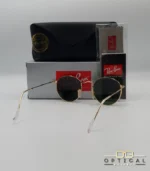 Lunettes de soleil Ray-Ban Round Metal RB3447 monture métallique dorée avec verres verts G-15, étui et boîte d'origine.