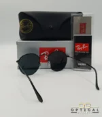 Lunettes de soleil Ray-Ban Round Metal RB3447 monture métallique noire mate avec verres noirs, étui et boîte d'origine.