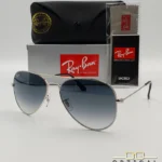 Lunettes de soleil Ray-Ban Aviator RB3025 monture métallique argentée avec verres dégradés bleus, étui et boîte d'origine.