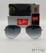 Lunettes de soleil Ray-Ban Aviator RB3025 monture métallique argentée avec verres dégradés bleus, étui et boîte d'origine.