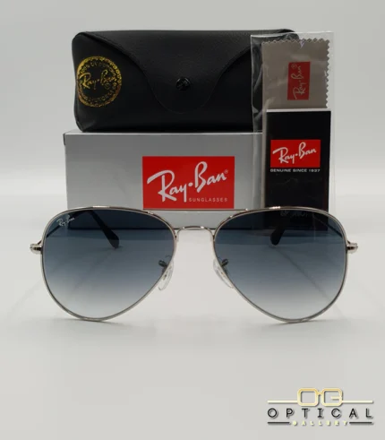 Lunettes de soleil Ray-Ban Aviator RB3025 monture métallique argentée avec verres dégradés bleus, étui et boîte d'origine.