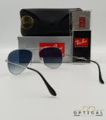 Lunettes de soleil Ray-Ban Aviator RB3025 monture métallique argentée avec verres dégradés bleus, étui et boîte d'origine.