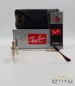 Lunettes de soleil Ray-Ban Hexagonal Flat Lenses RB3548N monture bicolore en métal doré et cerclage marron avec verres dégradés marrons, étui et boîte d'origine.