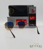Lunettes de soleil Ray-Ban Hexagonal Flat Lenses RB3548N monture bicolore en métal doré et cerclage marron avec verres dégradés marrons, étui et boîte d'origine.