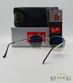 Lunettes de soleil Ray-Ban Hexagonal Flat Lenses RB3548N monture bicolore en métal doré et cerclage noir avec verres dégradés gris-bleu, étui et boîte d'origine.
