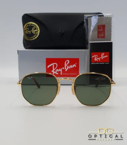 Lunettes de soleil Ray-Ban Hexagonal Flat Lenses RB3548N monture métallique dorée avec verres dégradés bleus, étui et boîte d'origine.
