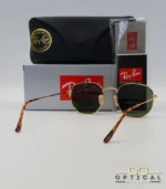 Lunettes de soleil Ray-Ban Hexagonal Flat Lenses RB3548N monture métallique dorée avec verres dégradés bleus, étui et boîte d'origine.