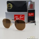 Lunettes de soleil Ray-Ban Hexagonal Flat Lenses RB3548N monture métallique dorée avec verres minéraux marrons classiques, étui et boîte d'origine.
