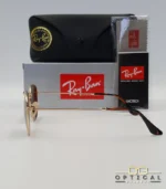 Lunettes de soleil Ray-Ban Hexagonal Flat Lenses RB3548N monture métallique dorée avec verres minéraux marrons classiques, étui et boîte d'origine.