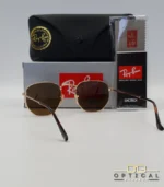 Lunettes de soleil Ray-Ban Hexagonal Flat Lenses RB3548N monture métallique dorée avec verres minéraux marrons classiques, étui et boîte d'origine.