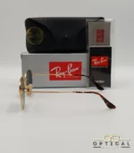 Lunettes de soleil Ray-Ban Aviator RB3025 monture métallique dorée avec verres dégradés bleus, étui et boîte d'origine.