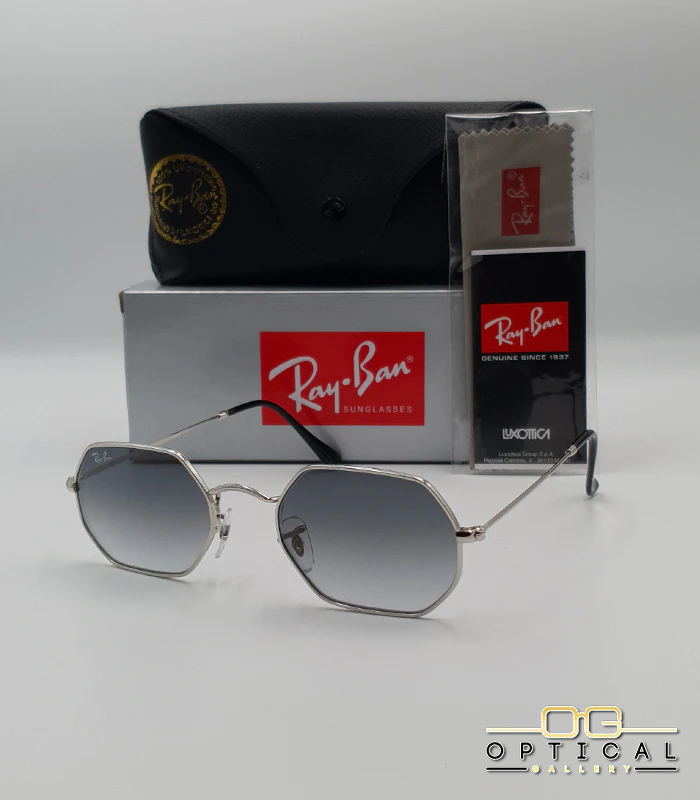 lunettes-de-soleil-ray-ban-octagonal-rb3556-argent-gris-degrade Lunettes de soleil Ray-Ban Octagonal RB3556 argentées avec verres dégradés gris, étui noir, boîte grise et accessoires.