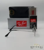 Lunettes de soleil Ray-Ban Octagonal RB3556 argentées avec verres dégradés gris, étui noir, boîte grise et accessoires.