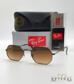 Lunettes de soleil Ray-Ban Octagonal RB3556 marron bronze avec verres dégradés marrons, étui noir, boîte grise et livret Luxottica.