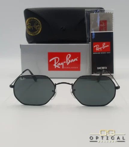 Lunettes de soleil Ray-Ban Octagonal RB3556 noires avec verres noirs, étui rigide, boîte grise et livret Luxottica.