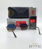 Lunettes de soleil Ray-Ban Octagonal RB3556 marron bronze avec verres dégradés marrons, étui noir, boîte grise et livret Luxottica.