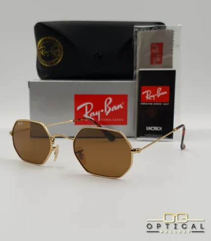 Lunettes de soleil Ray-Ban Octagonal RB3556 dorées avec verres marrons, étui noir, boîte et certificat Luxottica.
