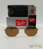 Lunettes de soleil Ray-Ban Octagonal RB3556 dorées avec verres marrons, étui noir, boîte et certificat Luxottica.